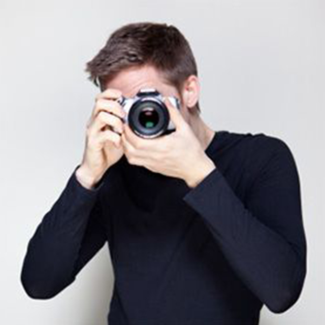 A man holding a camera.