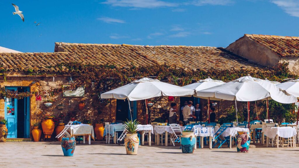 Scenic view of Marzamemi in Sicily, Italy, featuring historic architecture, charming streets, and the tranquil atmosphere of this coastal village.