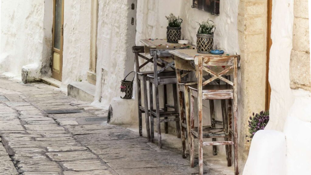 Charming cobblestone street in Ostuni, Puglia, Italy,