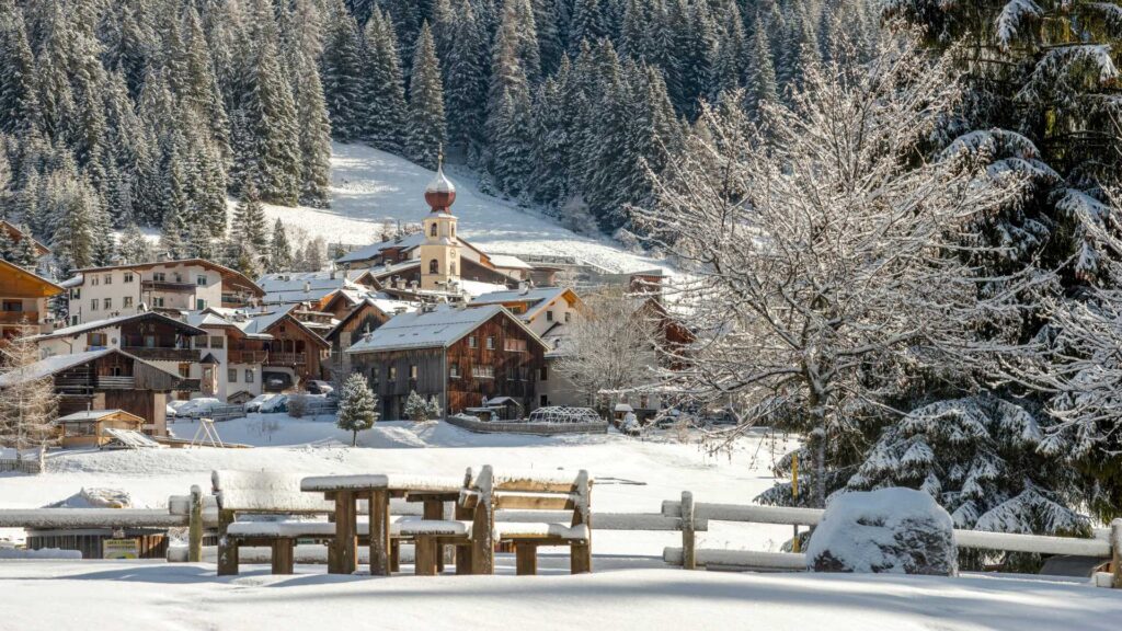 Italy Northern Marvels - Winter wonderland in Val di Fassa, featuring snow-covered landscapes, majestic mountains, and the serene beauty of the Italian Dolomites.