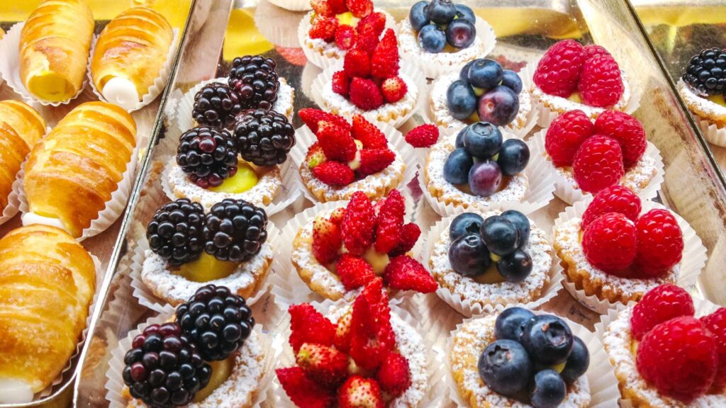 A tantalizing array of Italian desserts beautifully arranged in a bakery window display