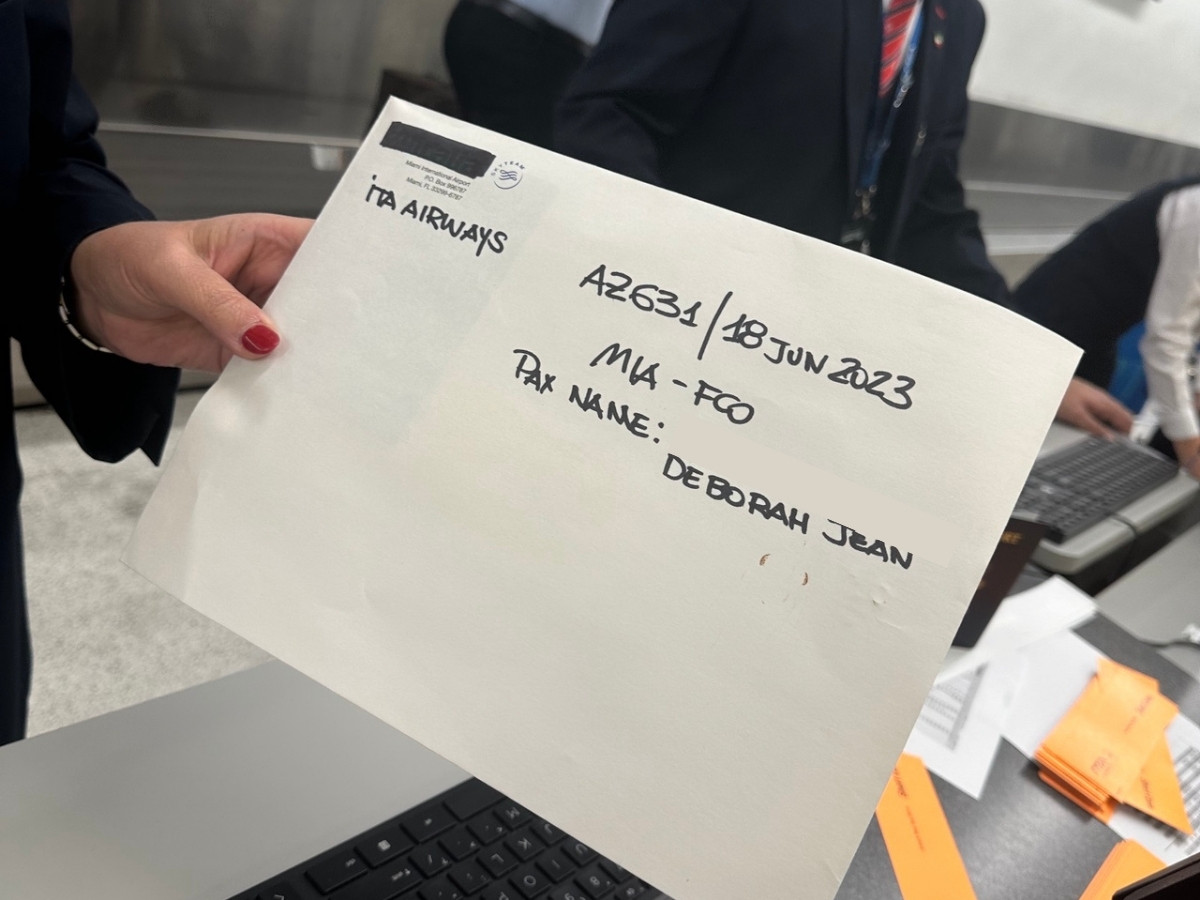 Handwritten ITA Airways envelope representing a passport delivery miracle