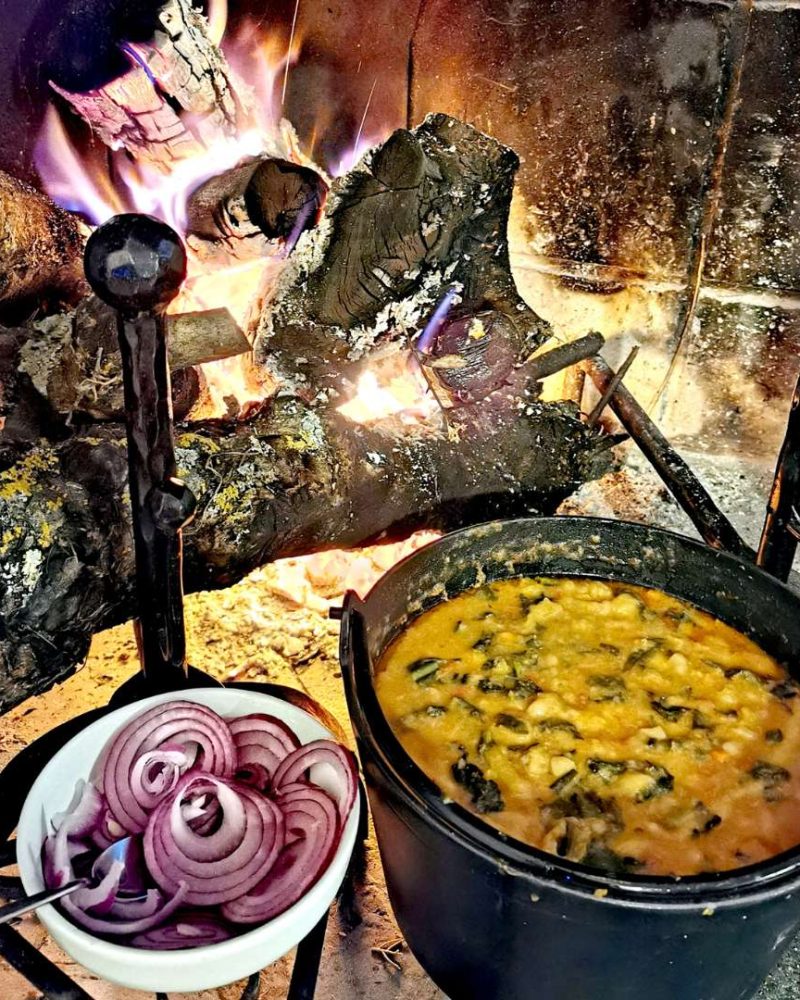 A hearty bowl of Ribollita Tuscan Soup, showcasing a medley of vegetables, beans, and rustic bread in a savory broth.