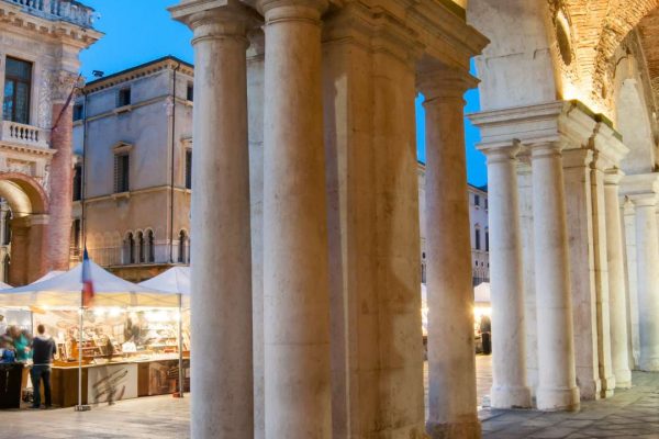 Architectural detail of columns and arches at the Palladian Basilica in Vicenza, Italy, showcasing the classical elegance of Palladio's design.